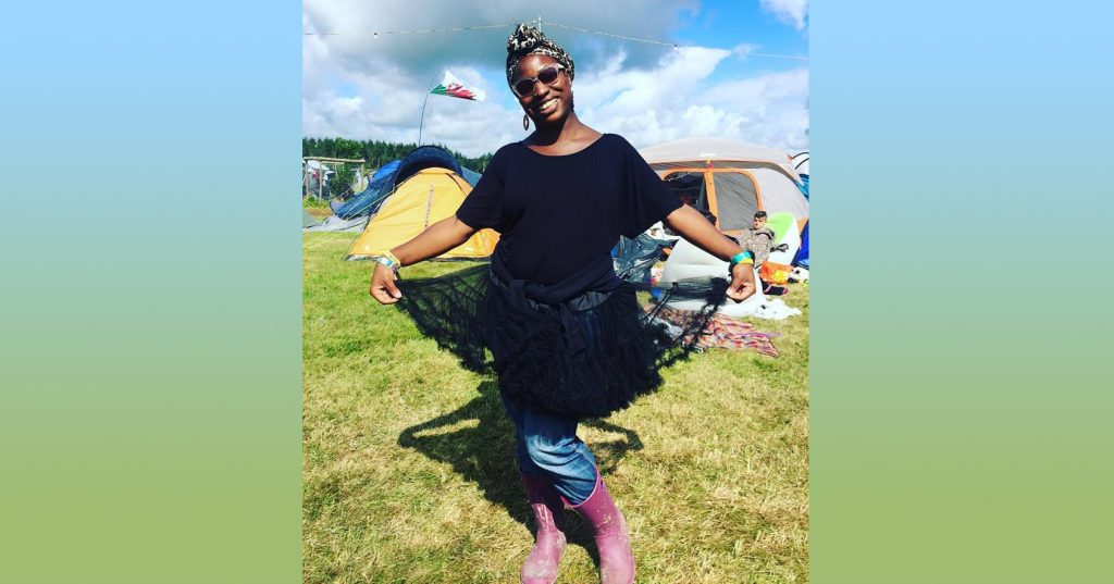 Uju in a fabulous black lace skirt in the campsite at Camp Bestival festival