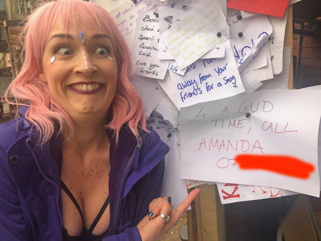 Amanda is stood in front of the 'telegram' we wrote, that says "4 a gud time, call Amanda: 07-----" (I blanked out the phone number) and she is pulling a very silly face.