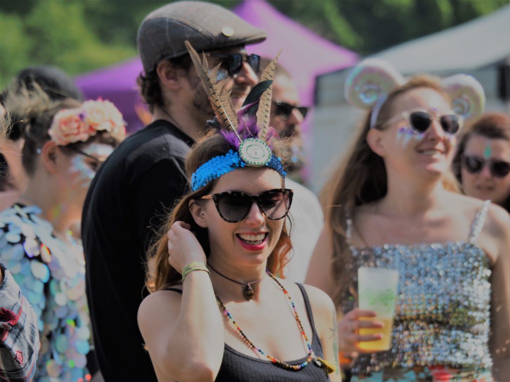 The smiling crowd in the sunshine at Under The Hill Festival 2018